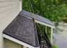 Roofing crew working on shingle roof installation
