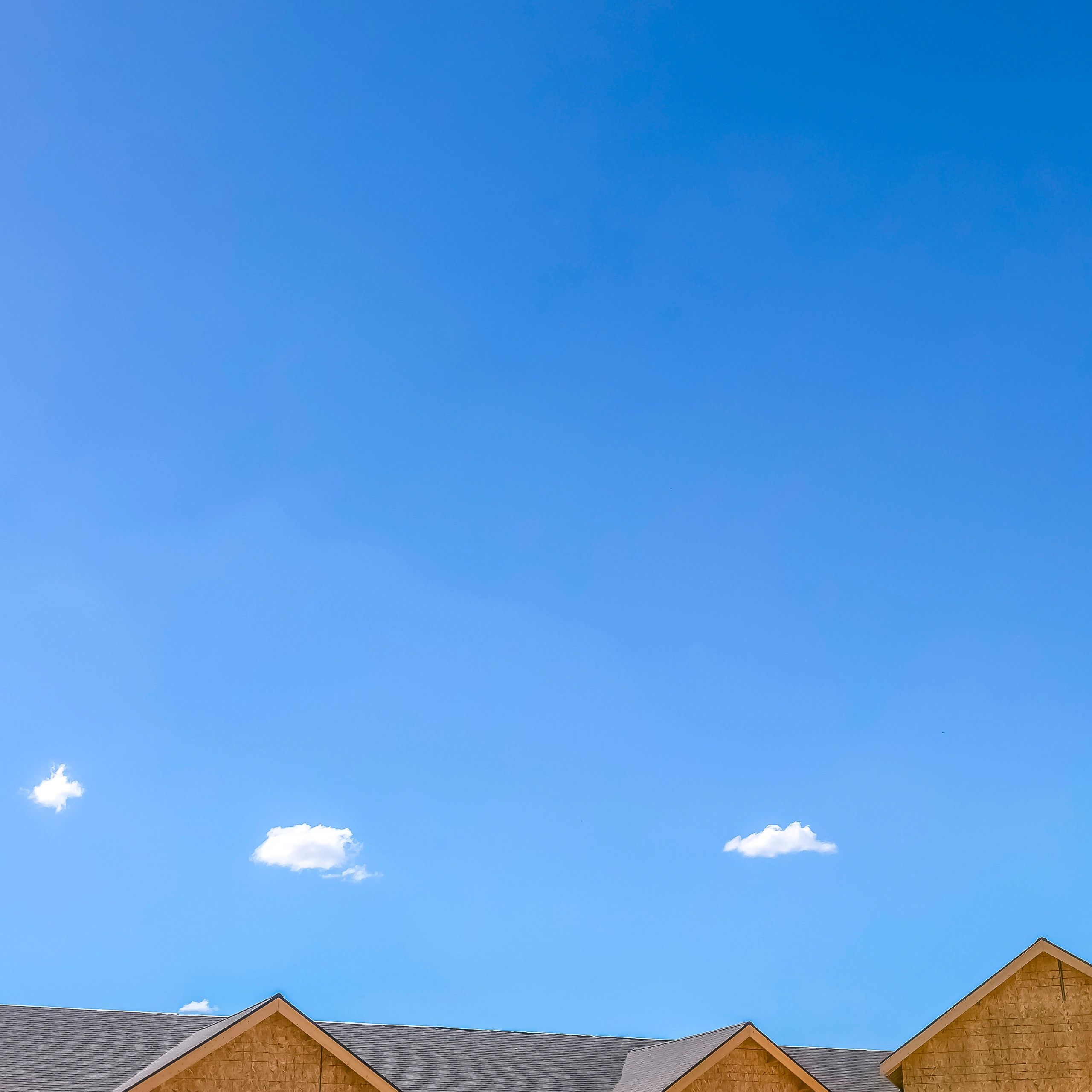 Clear sky over residential rooftops